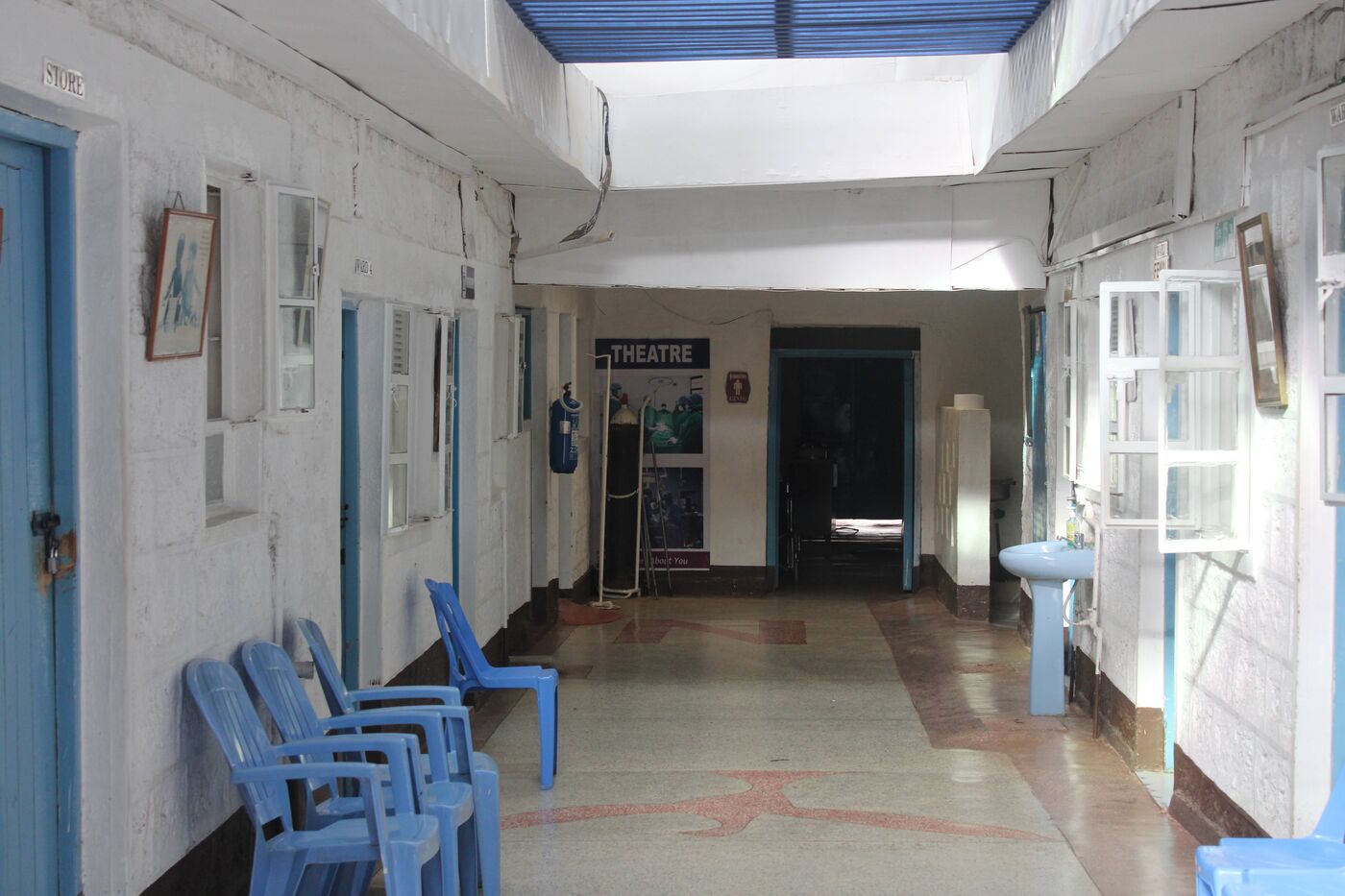 The corridor leading to the theatre wing, with seating for waiting families
